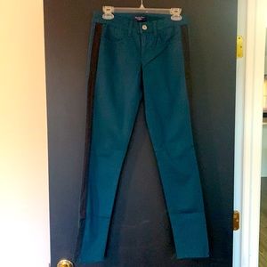 American Eagle Super Stretch deep blue green with black stripe on the side